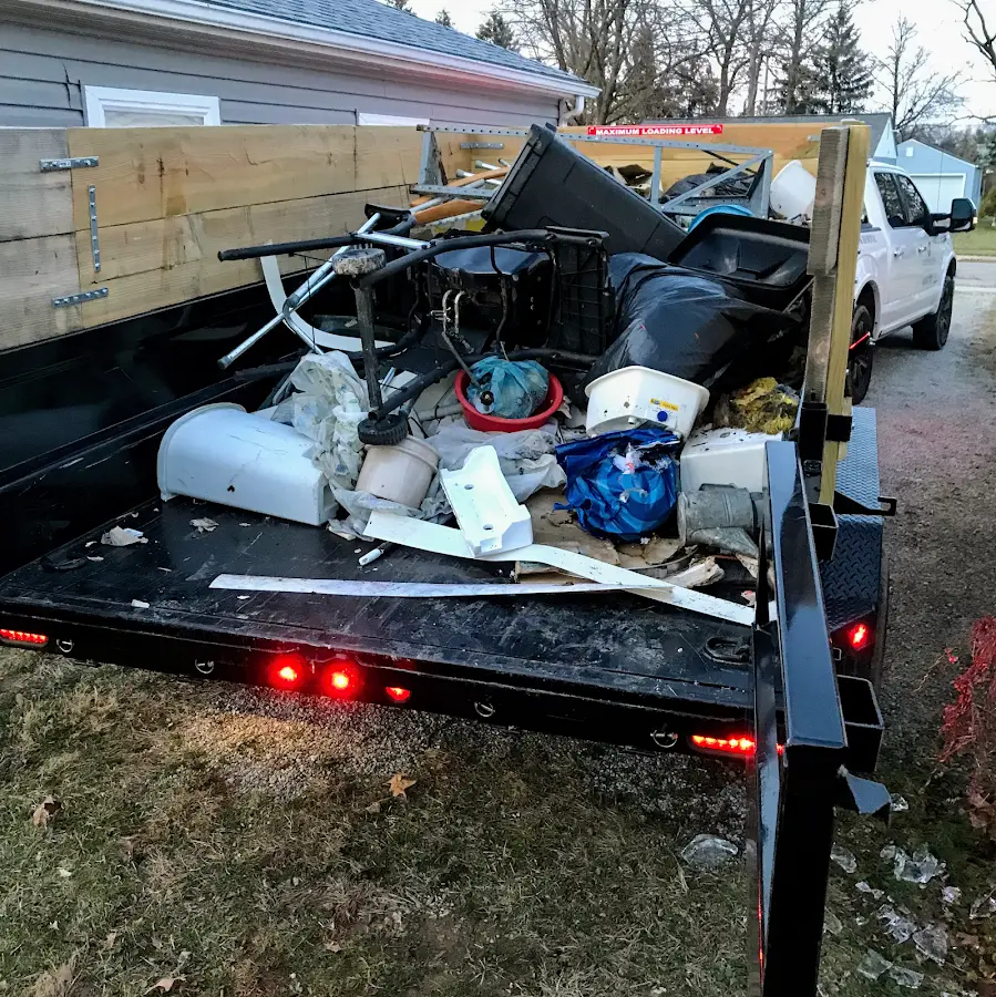 Roll-off dumpster delivered to a residential driveway in Bayville