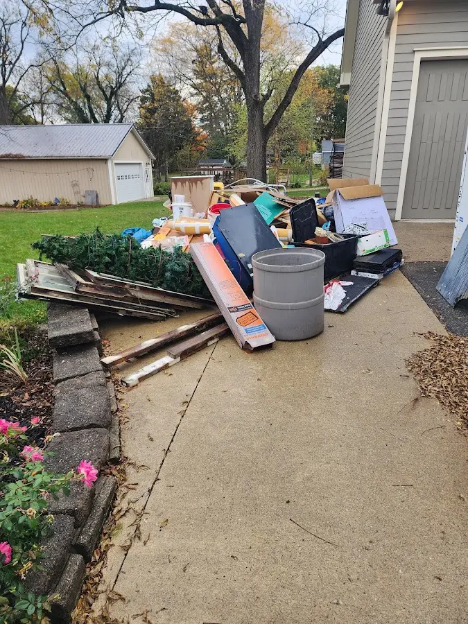Dumpster being loaded with debris for 30 Yard Dumpster Rental in Bayville